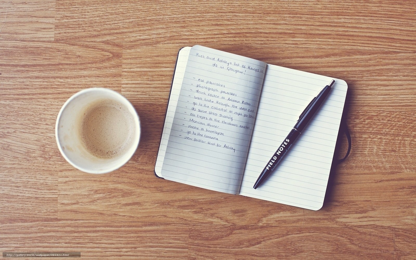 notebook and coffee on table