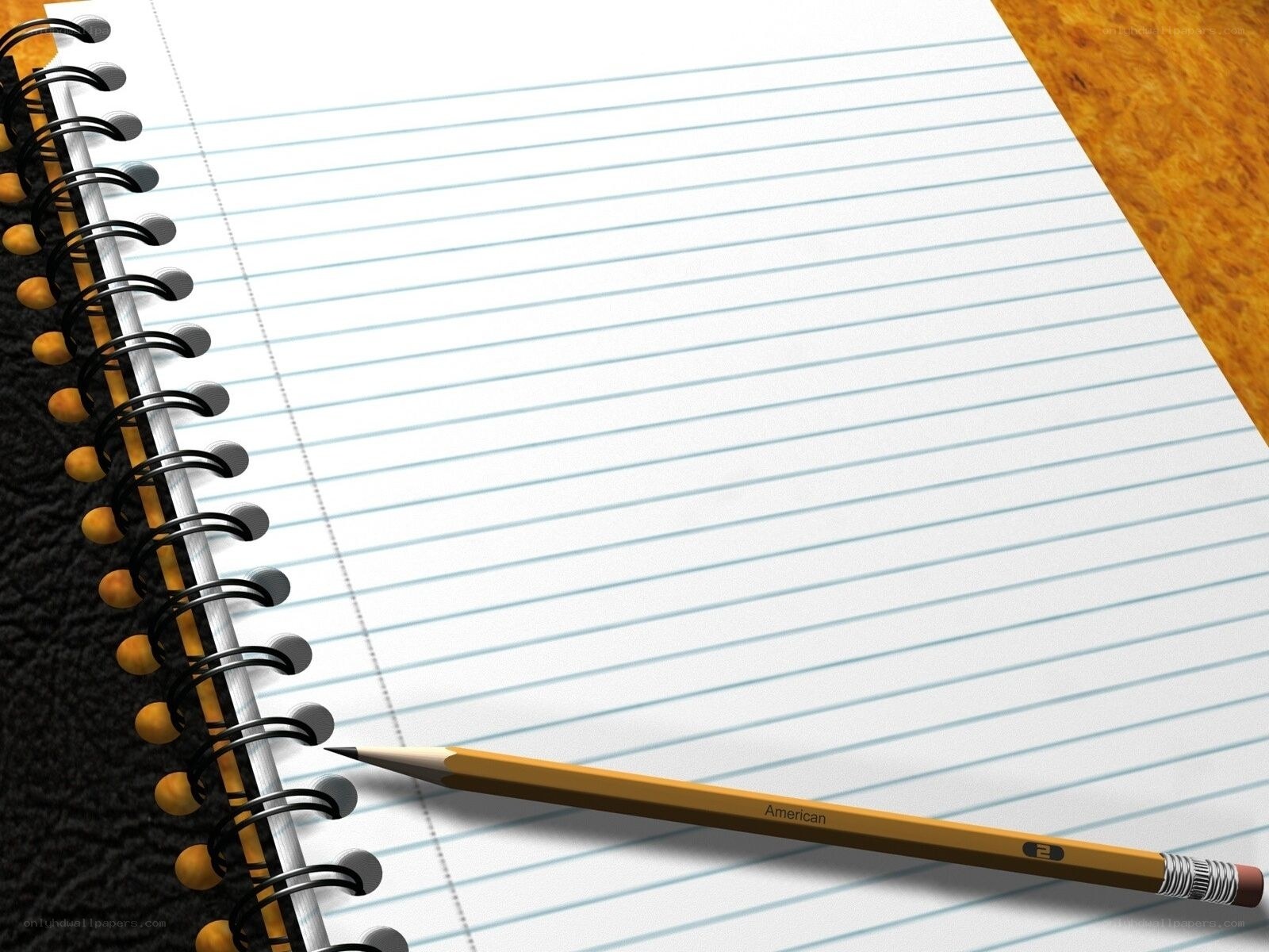 notebook and pencil on desk