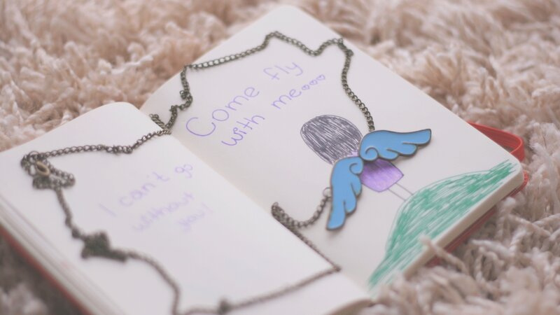 notebook with angel drawing
