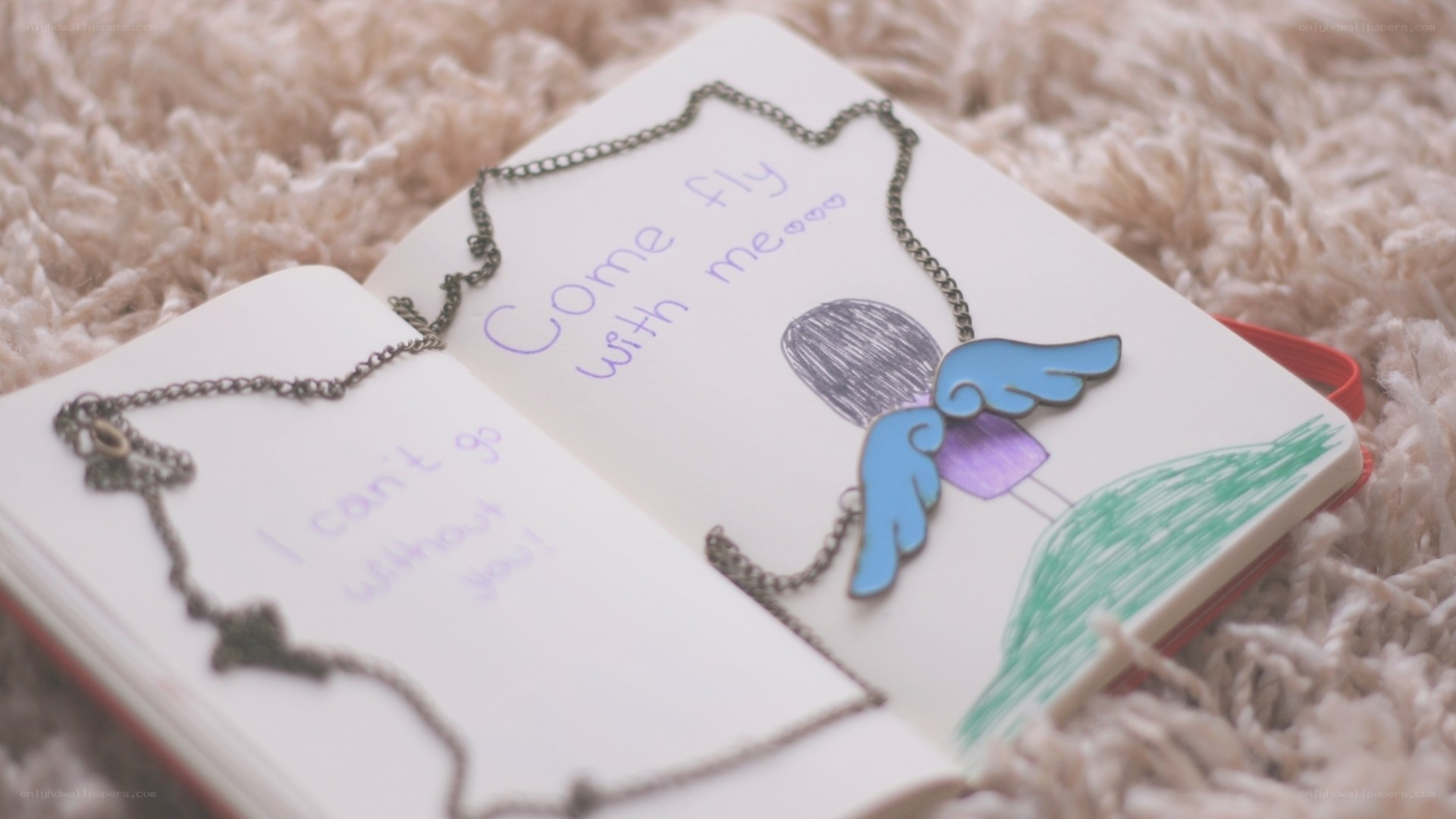 notebook with angel drawing