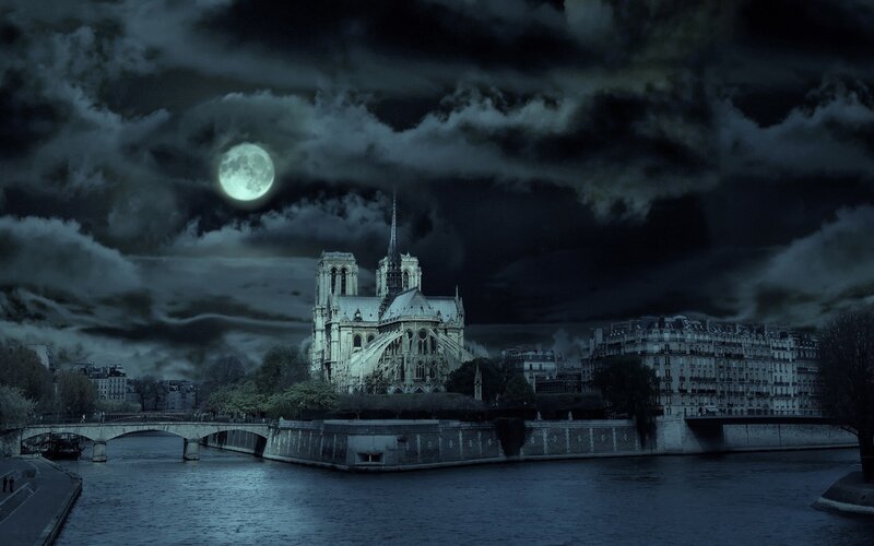 Notre-Dame at night under a full moon