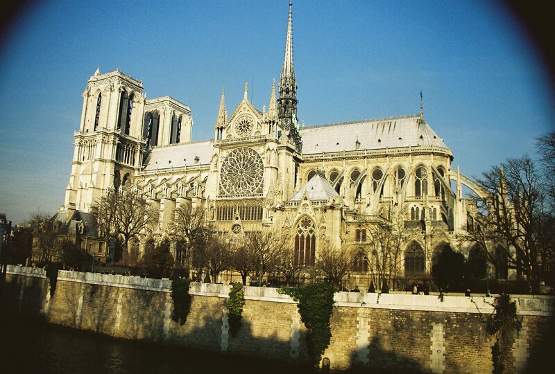 Notre-Dame Cathedral — Blue, Serene, Afternoon, Photograph, River, Trees, Stone Wall