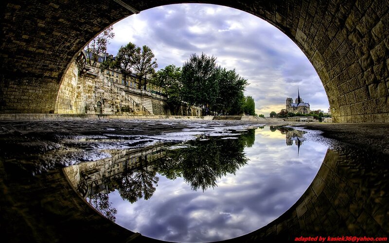 Notre-Dame reflected in a puddle
