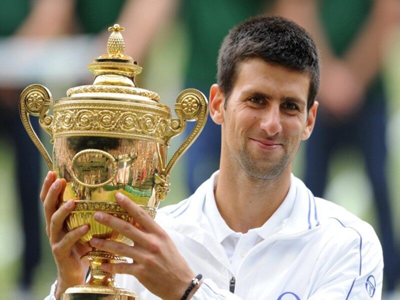 Novak Djokovic holding trophy