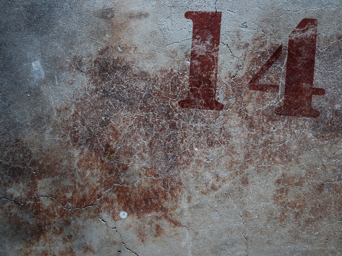 number 14 on concrete wall