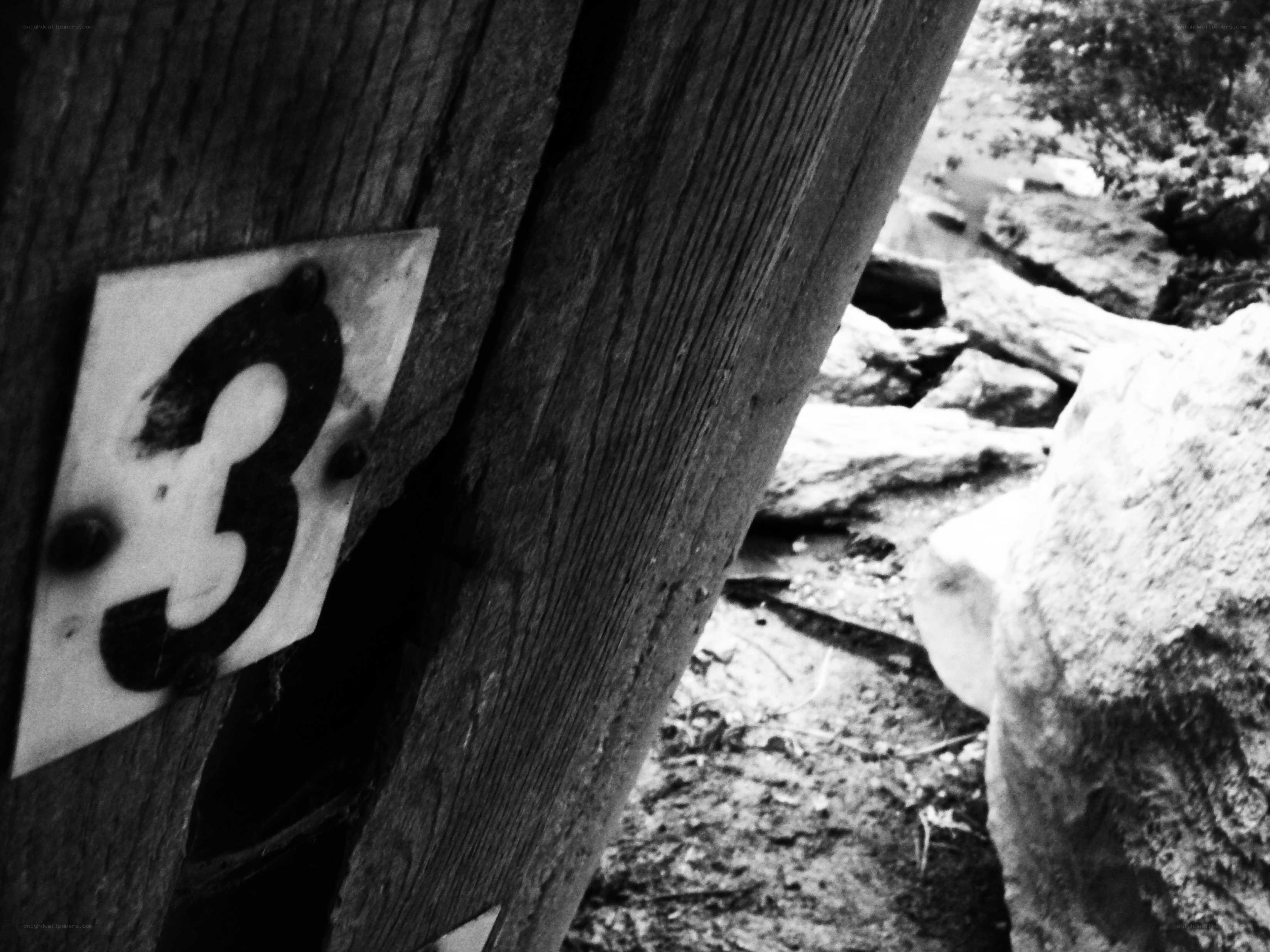 Number three on a wooden post