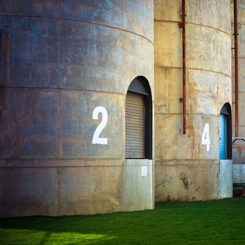 Numbered silos with grass