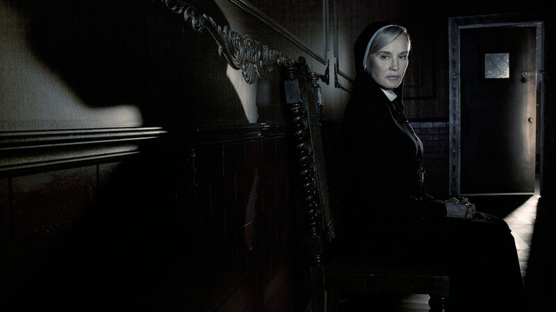 nun in a dark hallway