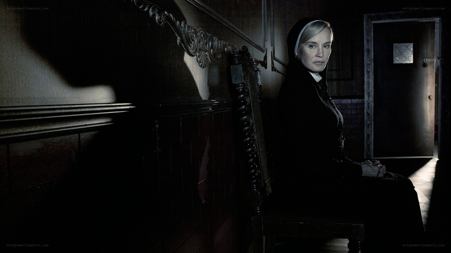 nun in a dark hallway