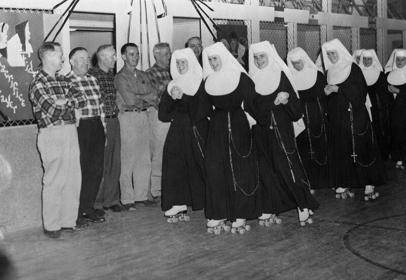 Nuns roller skating with men