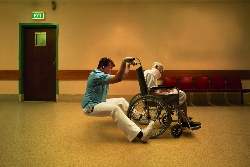 Nurse assisting patient in wheelchair