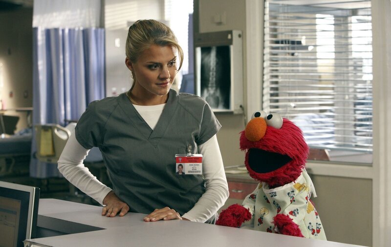 Nurse with Elmo in hospital