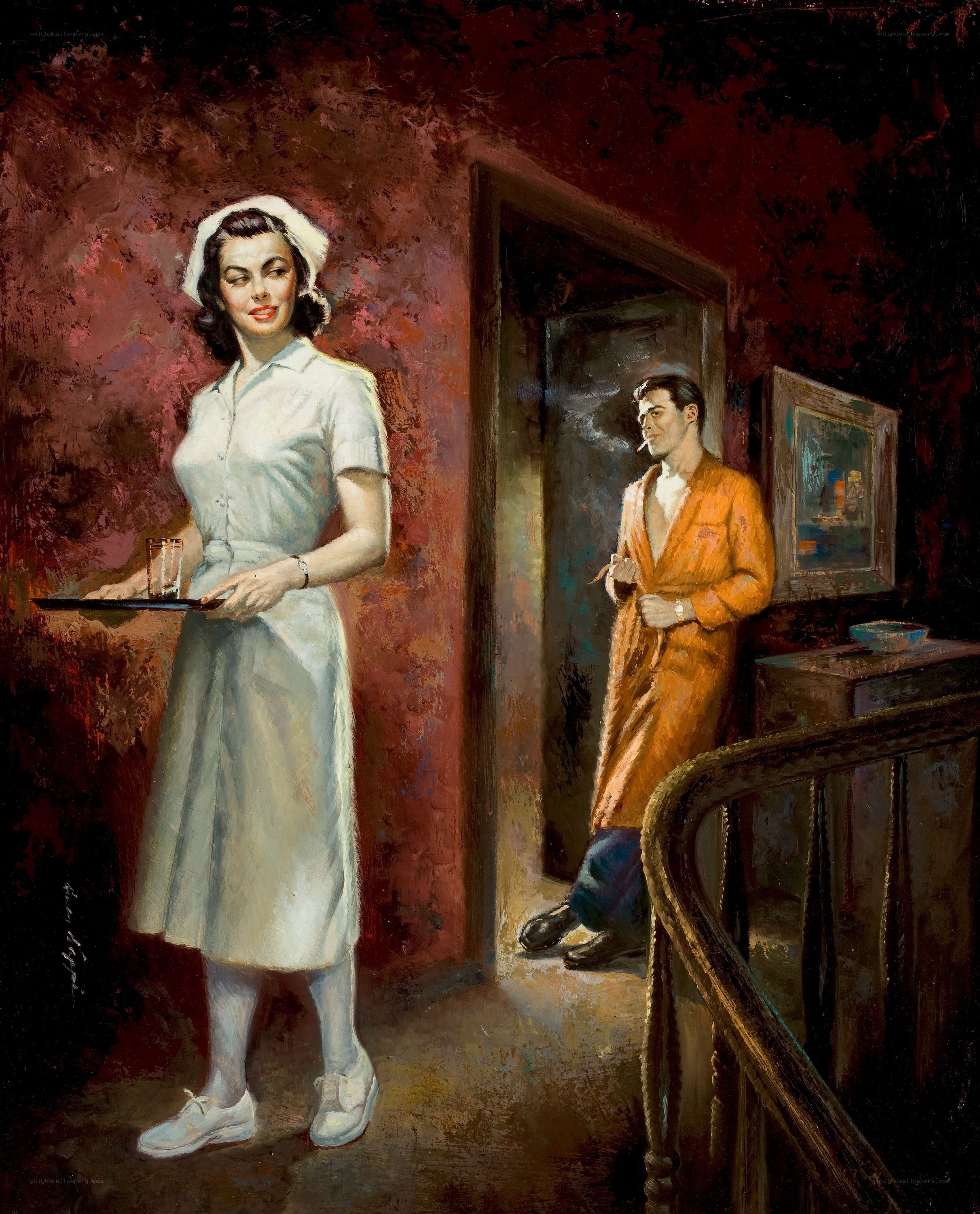 Nurse with tray in hallway