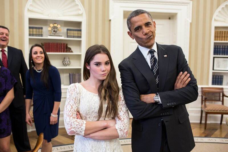 Obama and a young woman making faces