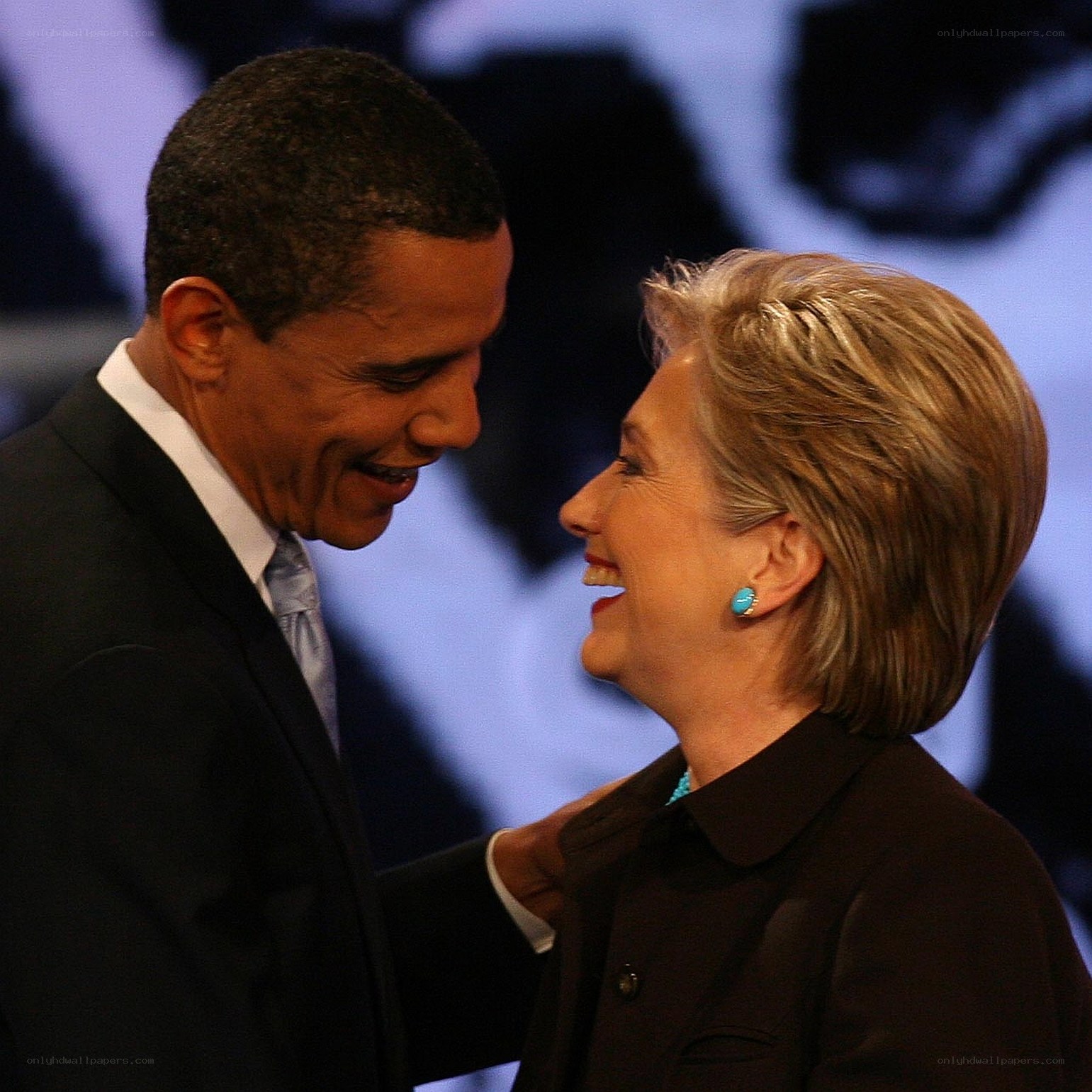 Obama and Clinton smiling