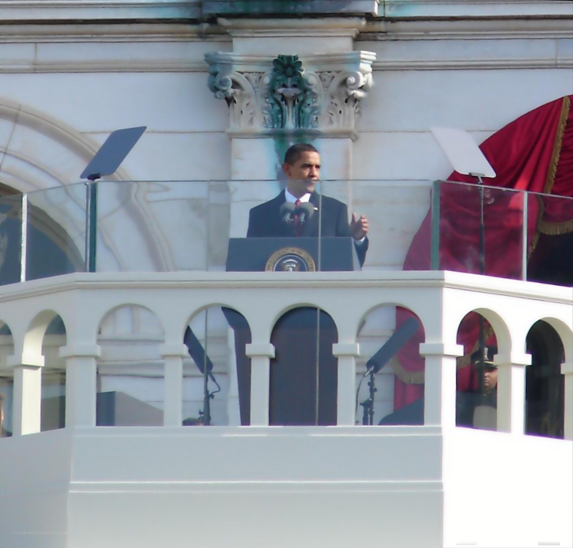 Obama at podium on balcony