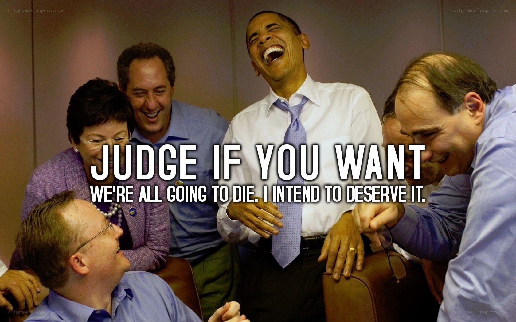 Obama laughing with staff