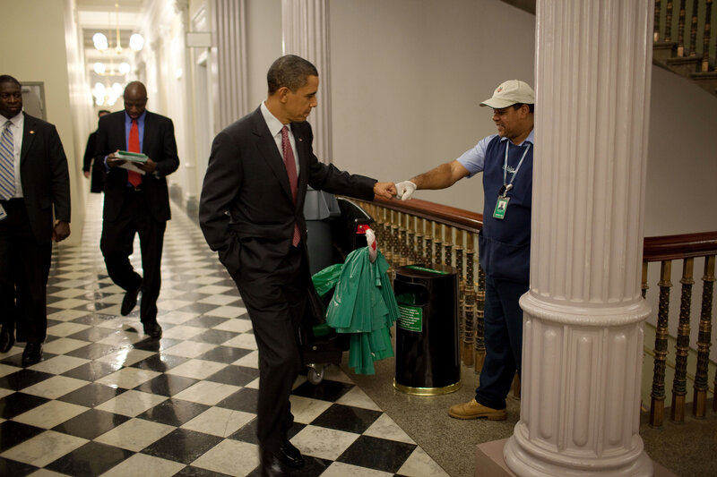 Obama shaking hands with worker