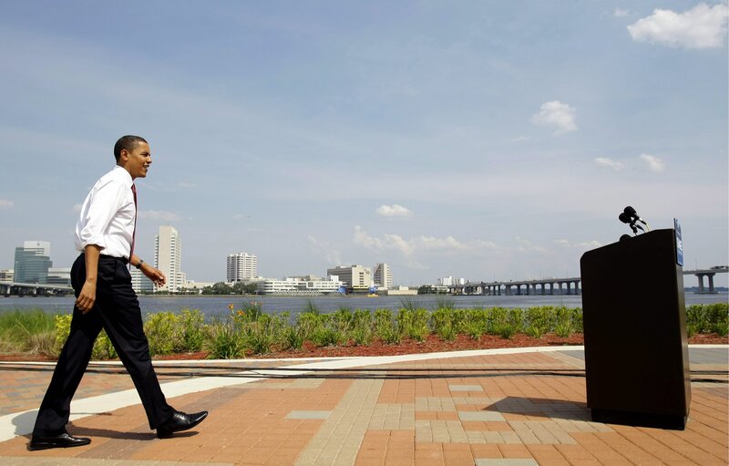 Obama walking near waterfront
