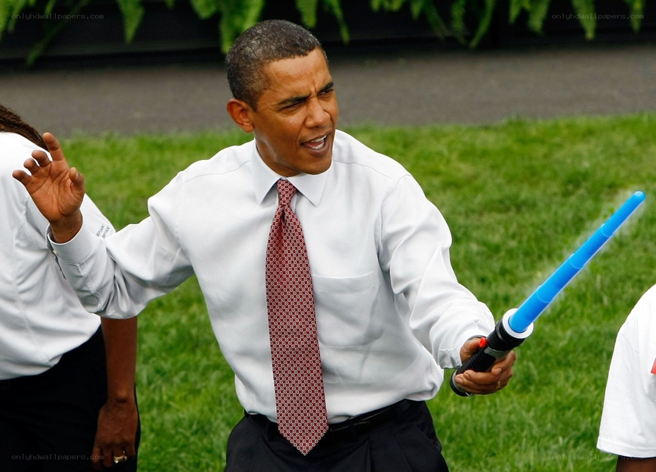 Obama with lightsaber toy