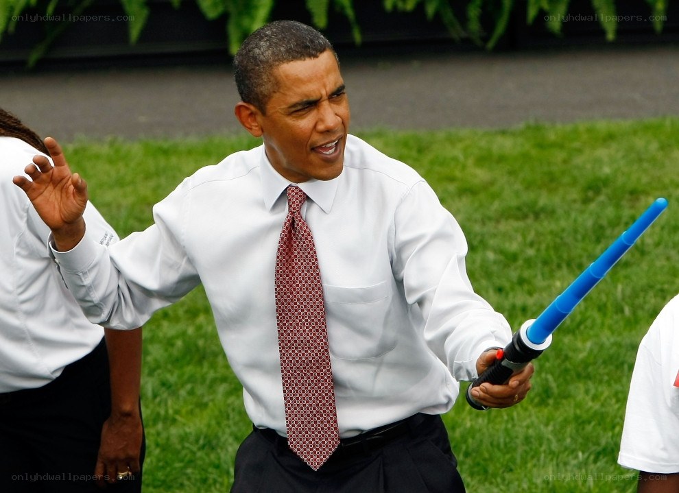 Obama with toy lightsaber