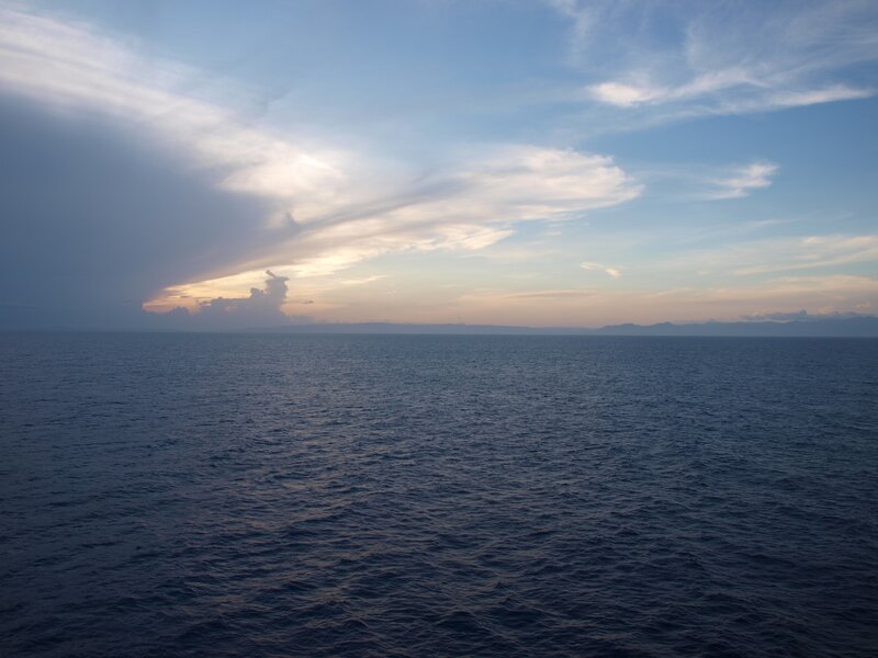 Ocean at dusk with clouds
