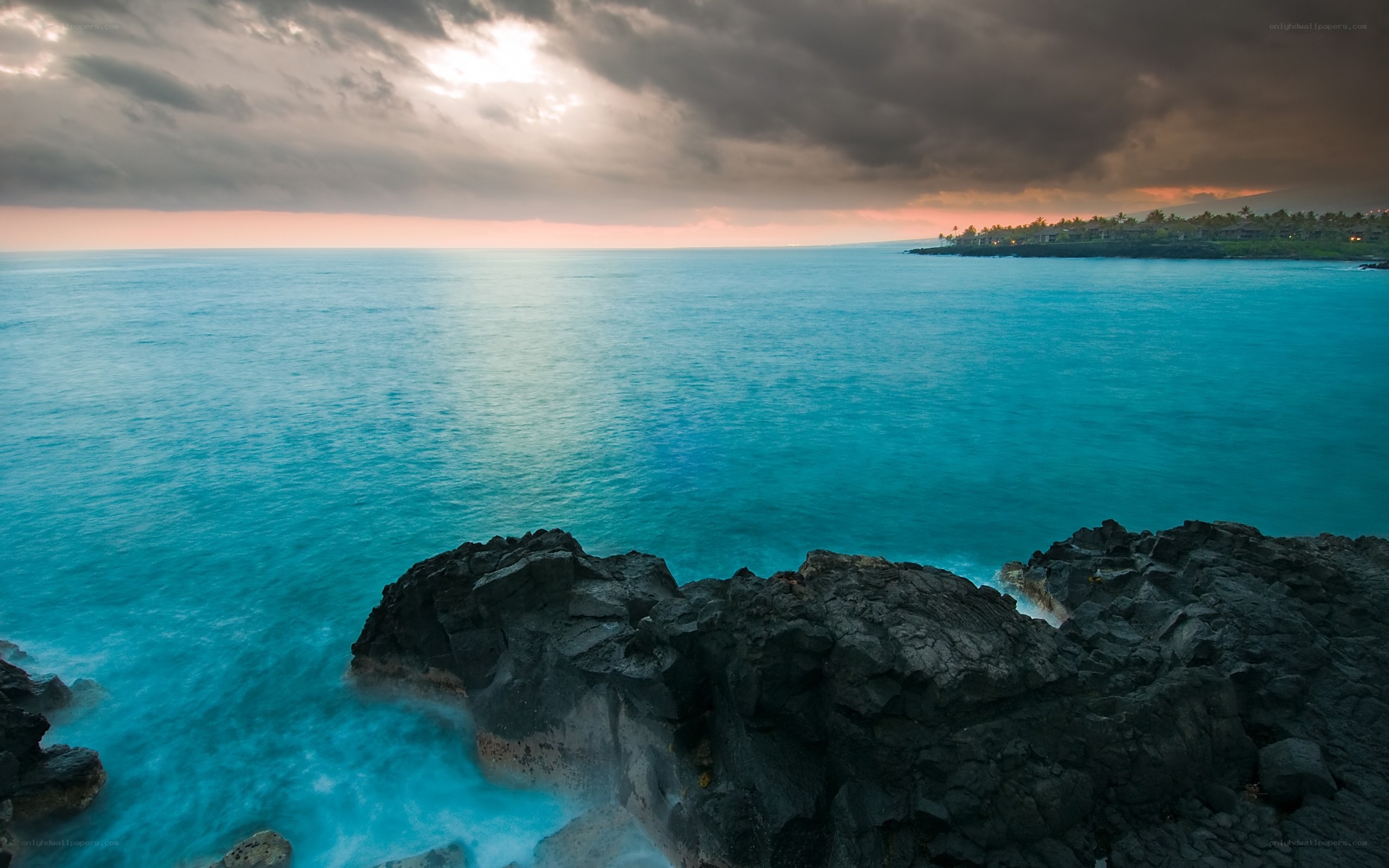 Ocean at dusk with rocky shore
