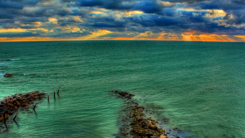 Ocean at Sunset — Blue, Dramatic, Photograph, Clouds, Rocks, Sunbeams