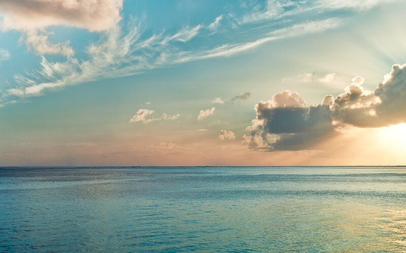 Ocean at Sunset — Blue, Serene, Photograph, Sky, Clouds, Sun, Orange, White