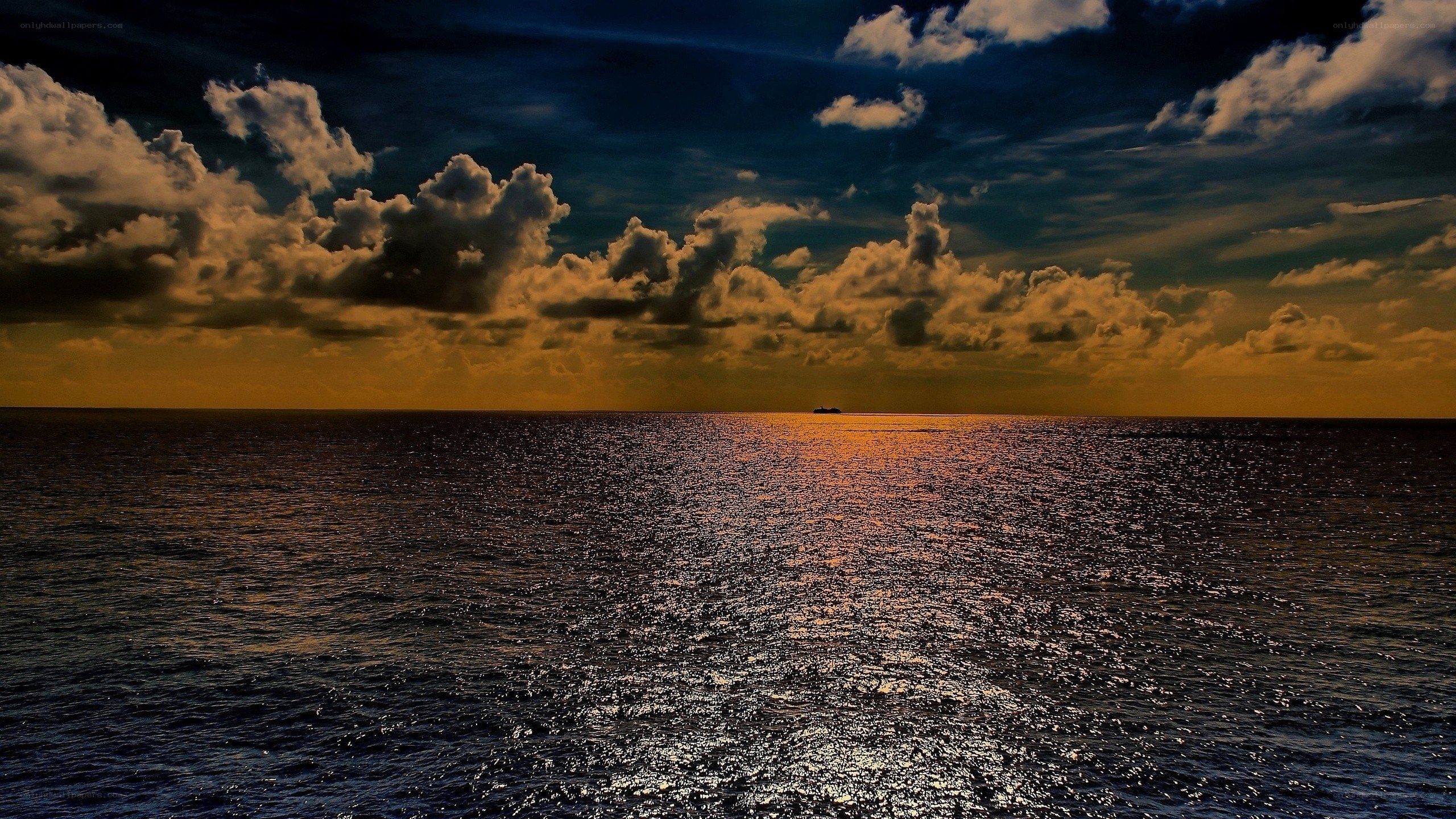 Ocean at sunset with clouds