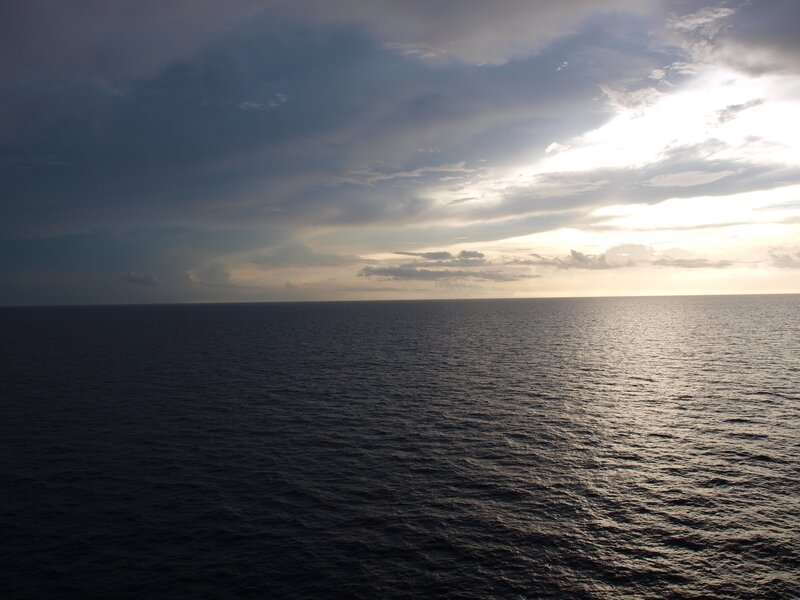 ocean at sunset with clouds