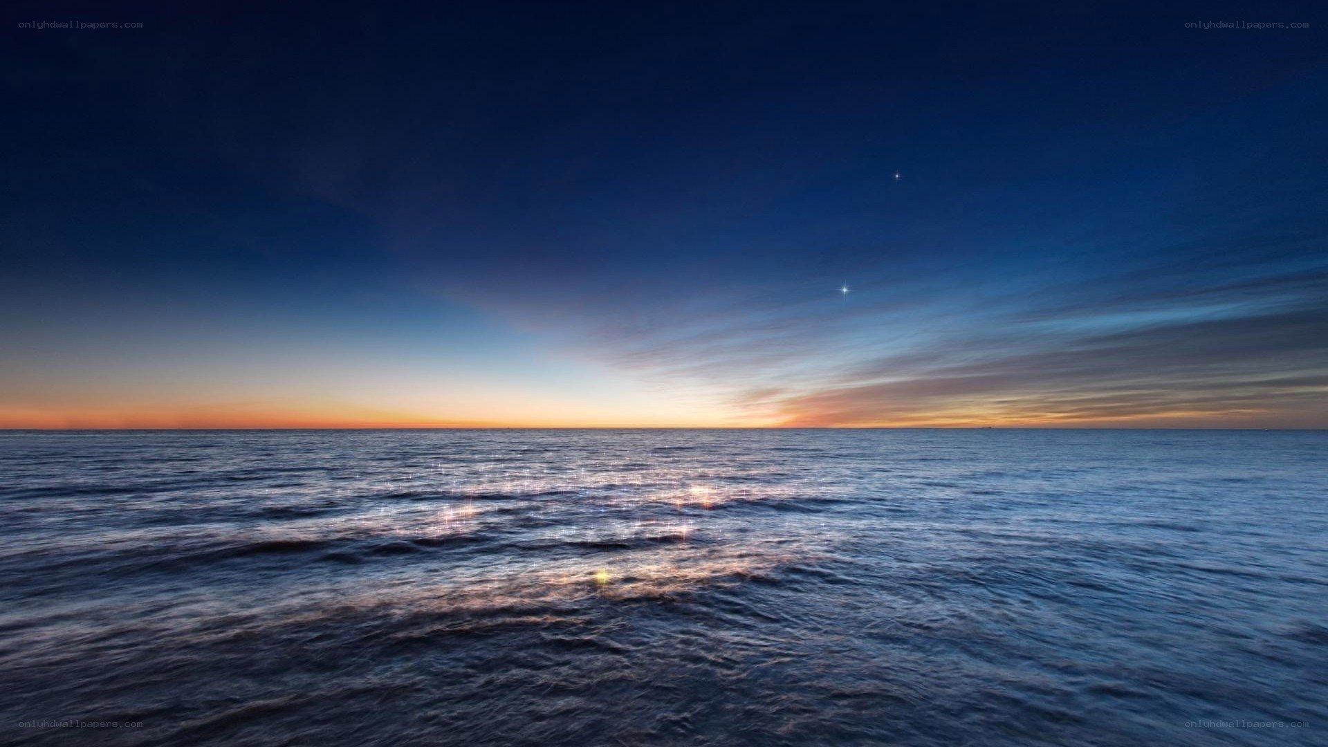 Ocean at twilight with stars