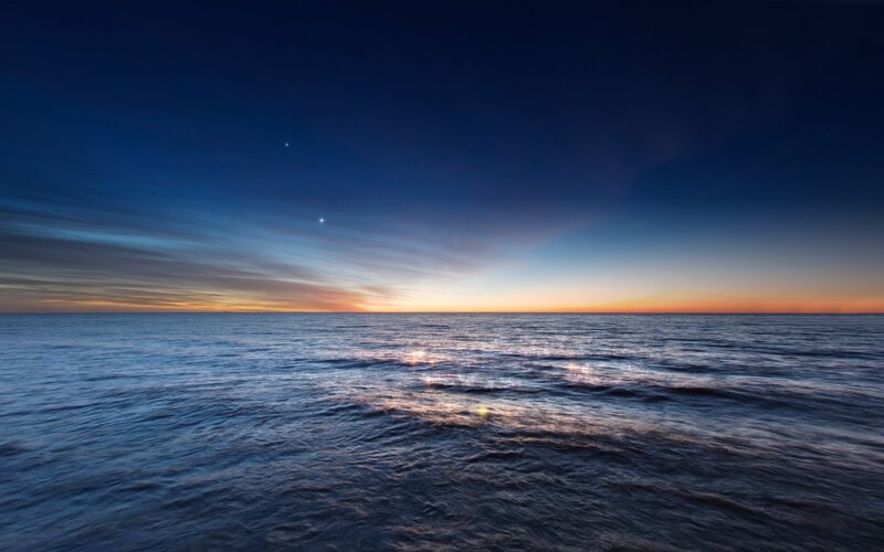Ocean at twilight with stars