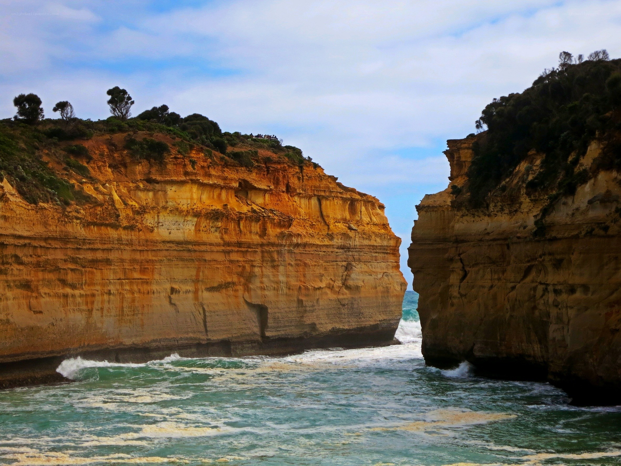 Ocean cliffs with natural arch