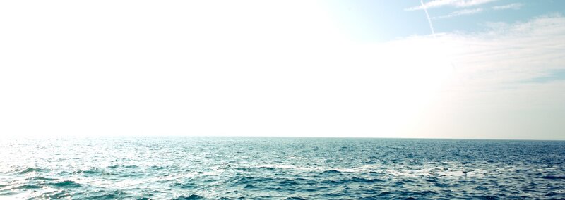 ocean horizon under bright sky