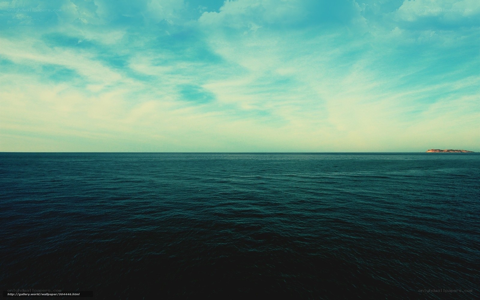 Ocean horizon with distant island