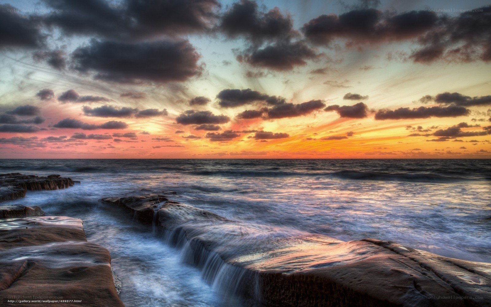 Ocean sunset over rocks