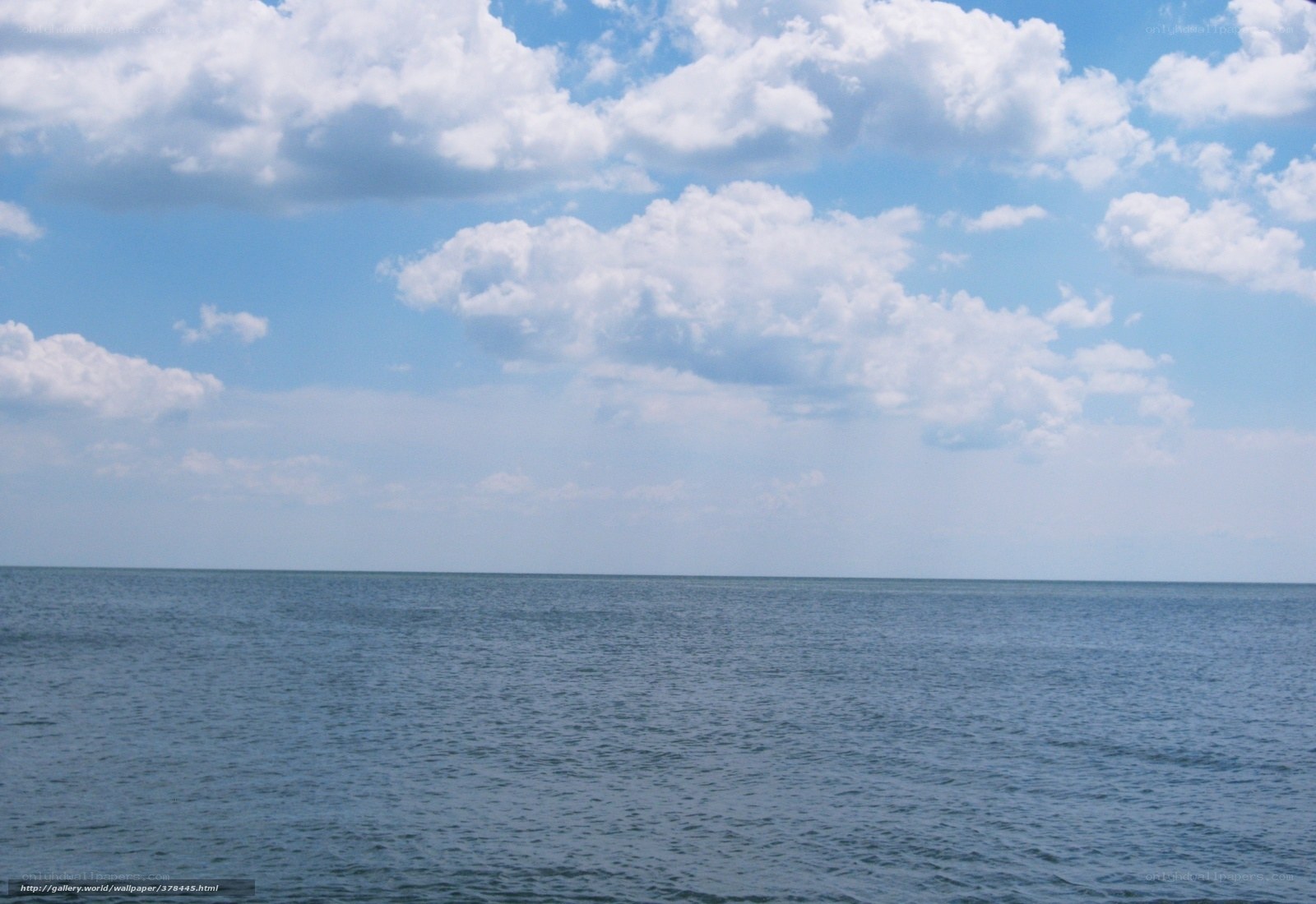 Ocean under cloudy sky