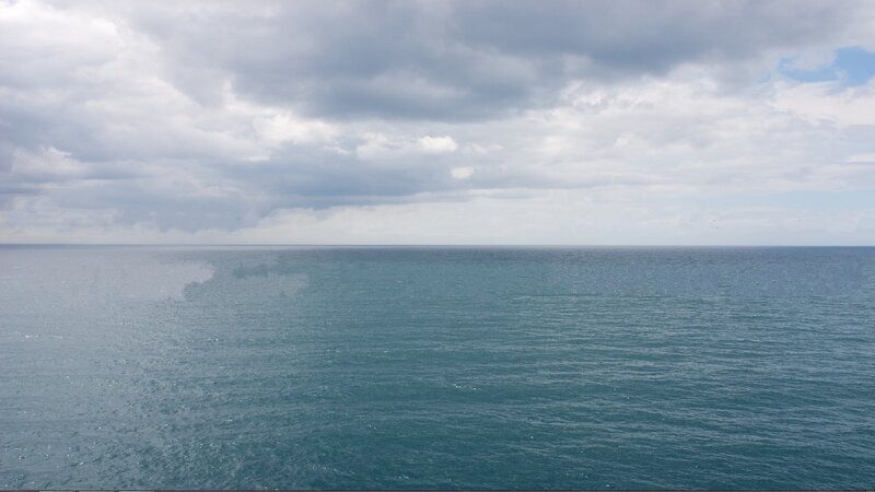 ocean under cloudy sky