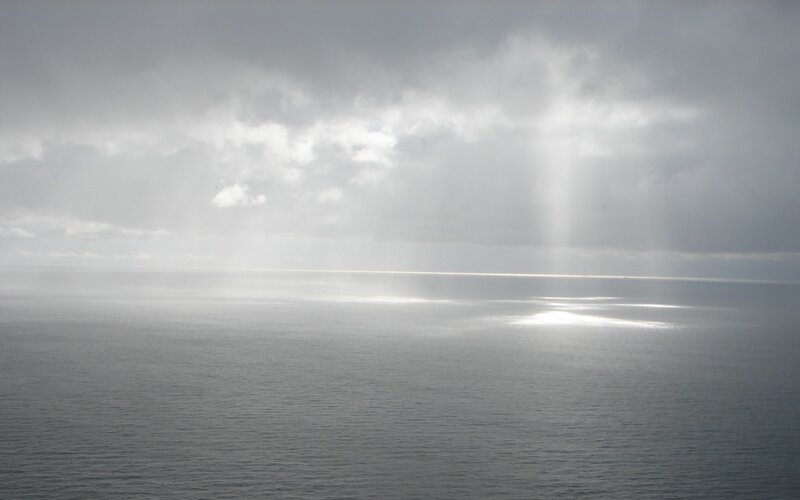 Ocean under Cloudy Sky — Gray, Dramatic, Photograph