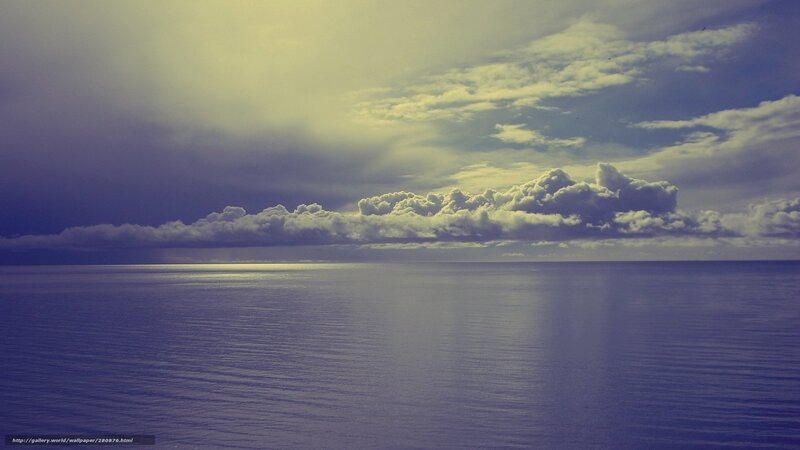 Ocean under cloudy sky
