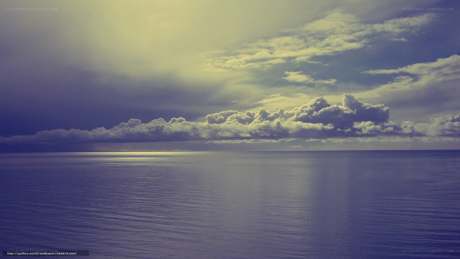 Ocean under cloudy sky