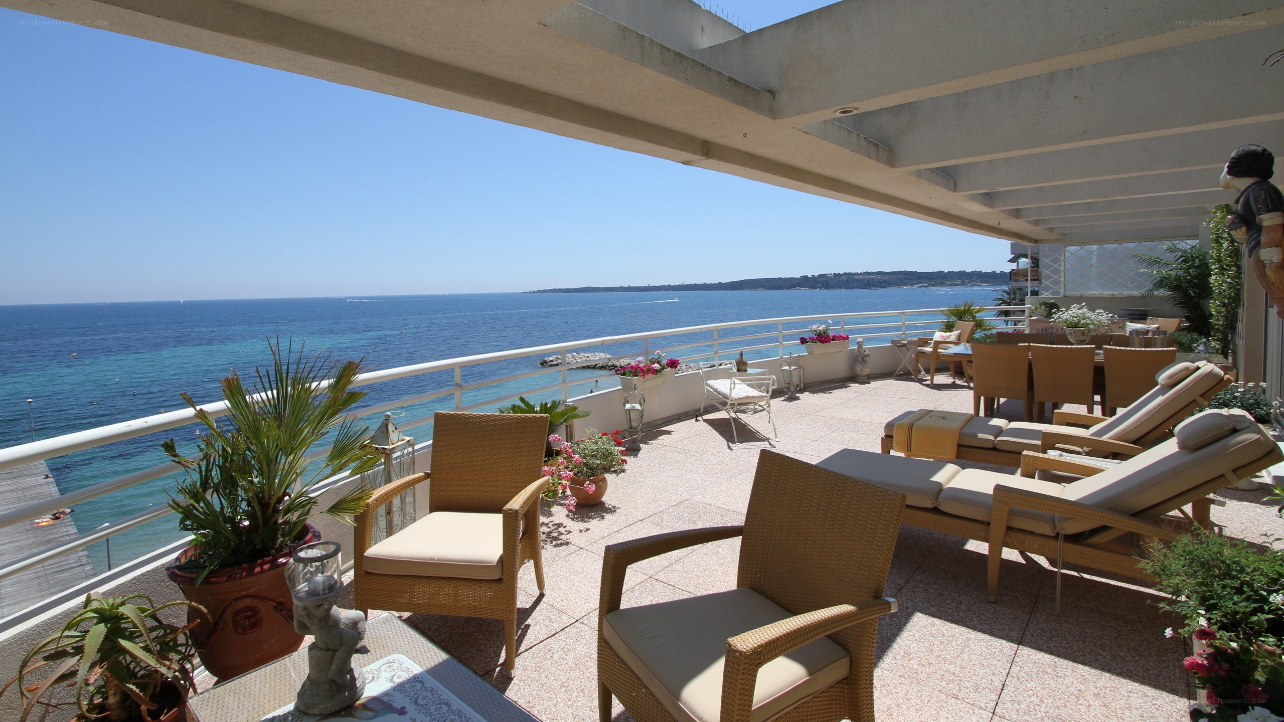 Ocean-view balcony with lounge chairs