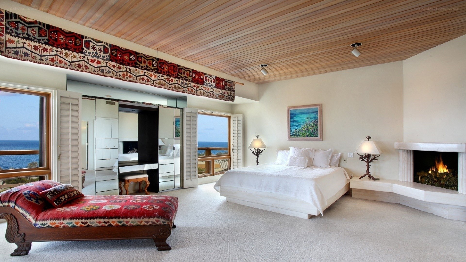 Ocean-view bedroom with fireplace