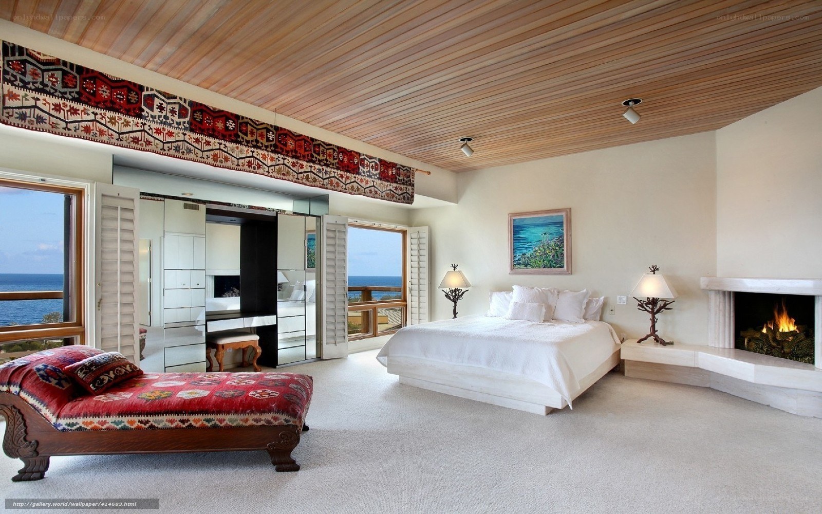 Ocean-view bedroom with fireplace
