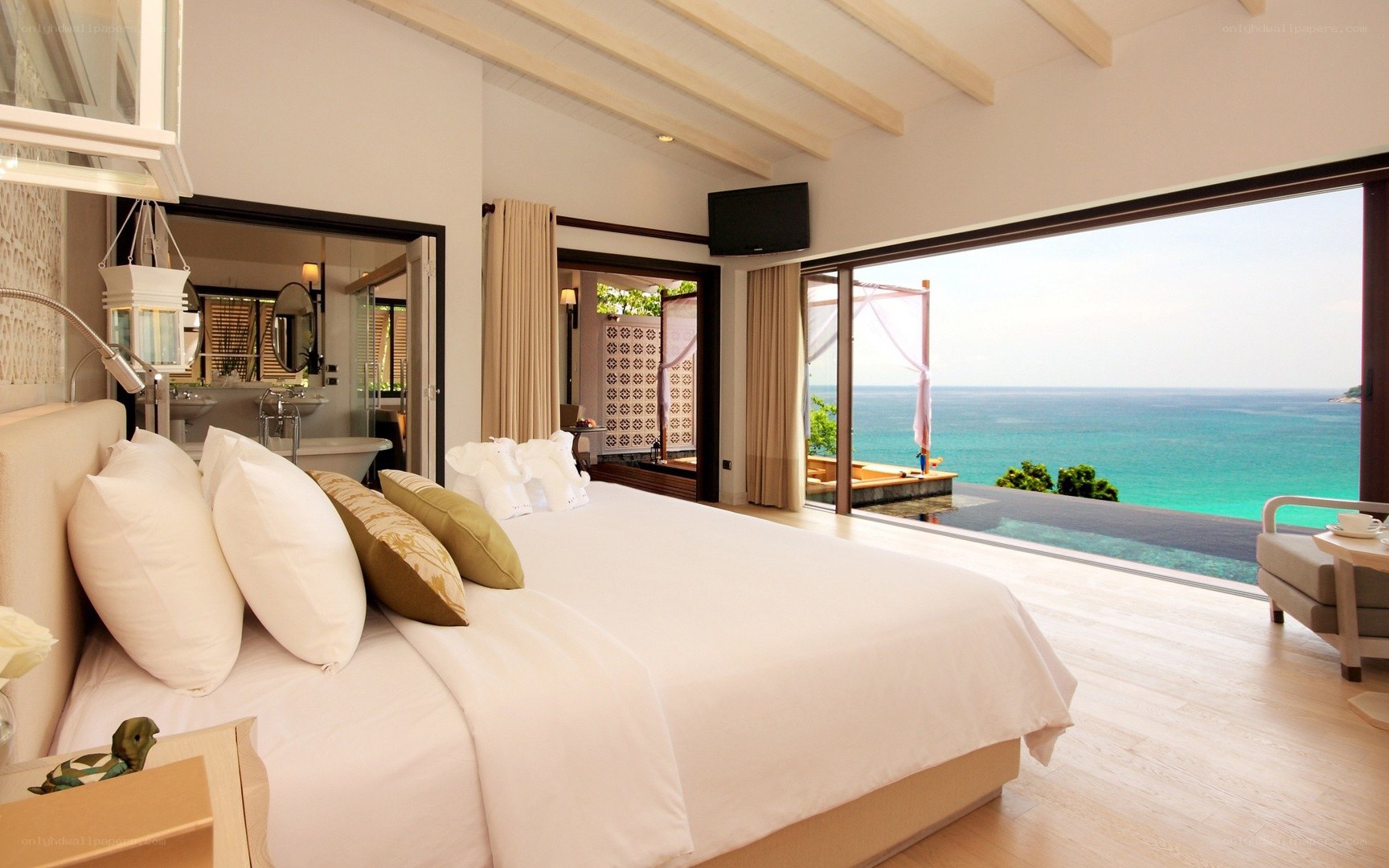 Ocean-view bedroom with infinity pool