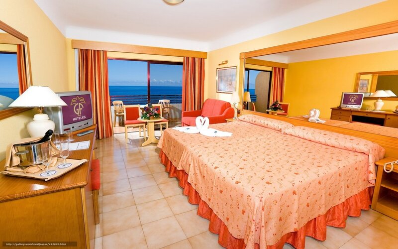 Ocean-view hotel room with swan towels