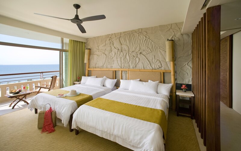 Ocean-view hotel room with two beds