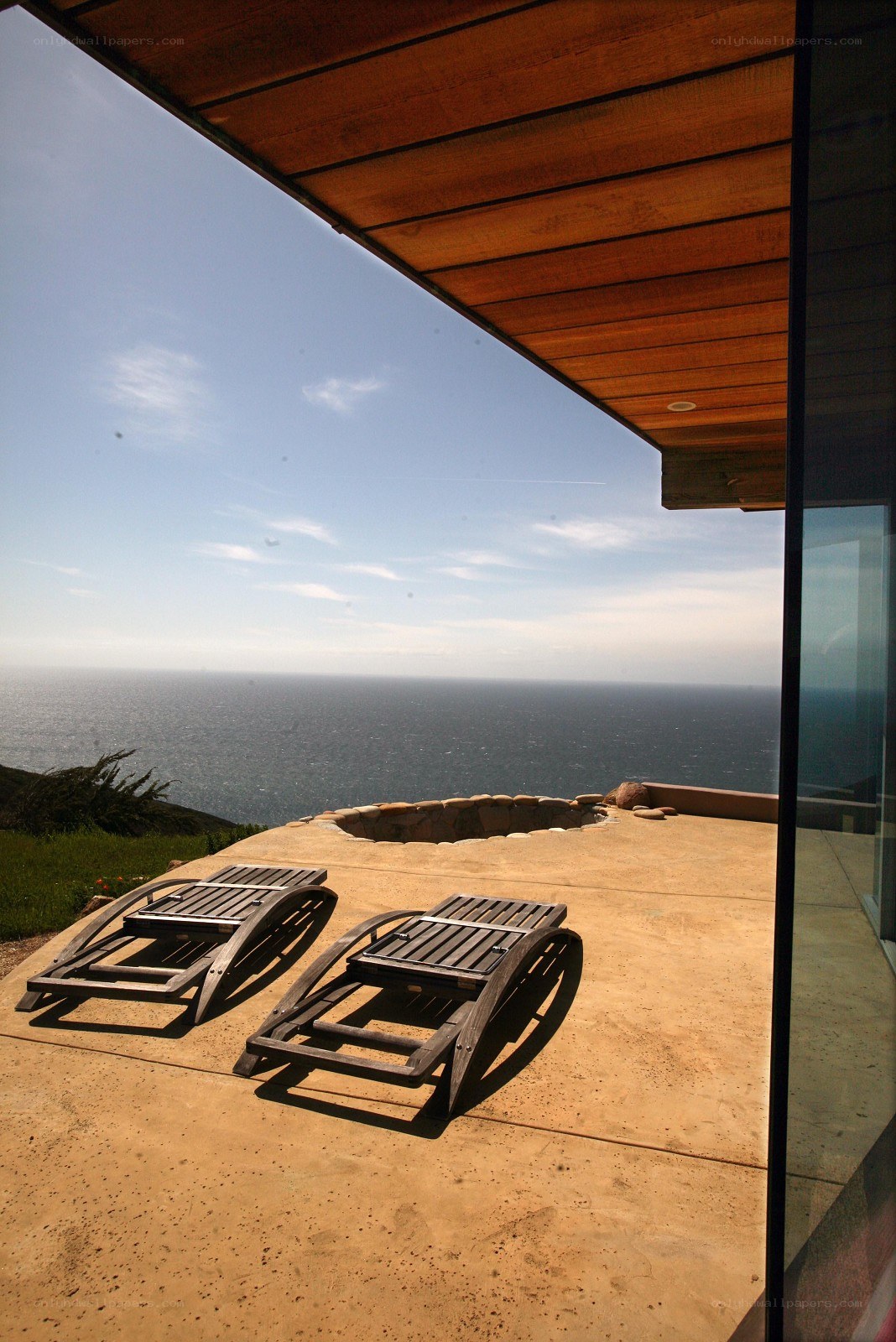 Ocean view patio with lounge chairs