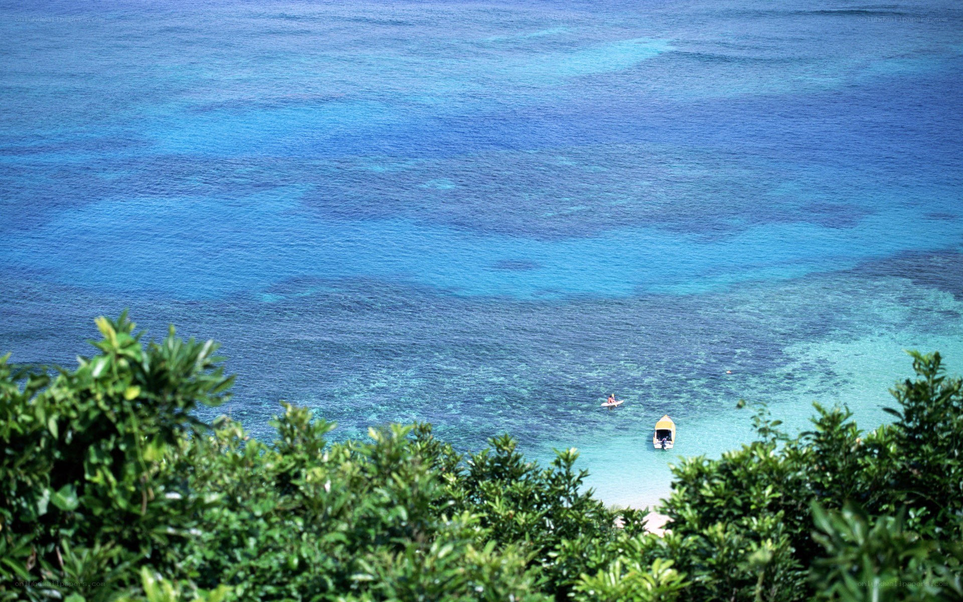 Ocean view with boat and kayaker